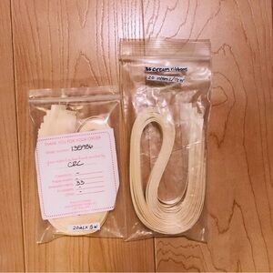 68 pieces of cream colored precut ribbon